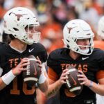 Texas Longhorns quarterbacks Arch Manning (16), left, and Quinn Ewers (3) throw passes while warming up ahead of the Longhorns' spring Orange and White game at Darrell K Royal Texas Memorial Stadium in Austin, Texas