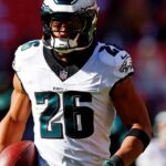 Philadelphia Eagles running back Saquon Barkley (26) warms up before playing against the Washington Commanders at Northwest Stadium.