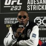 Israel Adesanya talks to the media after losing to Sean Strickland (not pictured) during UFC 293 at Qudos Bank Arena.