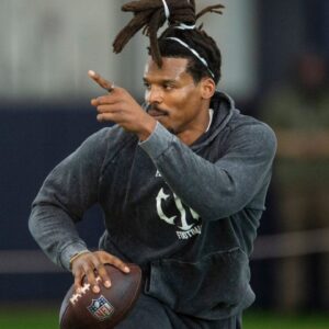Former Auburn quarterback and NFL MVP Cam Newton runs a drill during Auburn Tigers Pro Day at Woltosz Football Performance Center in Auburn, Ala., on Tuesday, March 21, 2023.