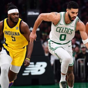 Boston Celtics forward Jayson Tatum (0) dribbles the ball up the court past Indiana Pacers forward Jarace Walker (5) during the first half at TD Garden.
