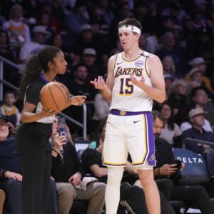 NBA female referee Danielle Scott (87) talks with Los Angeles Lakers guard Austin Reaves (15) in the second half against the Memphis Grizzlies at Crypto.com Arena.