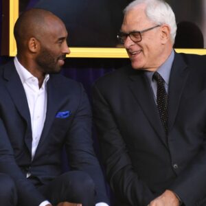 Kobe Bryant (left) and Phil Jackson react during ceremony to unveil statue of Los Angeles Lakers former center Shaquille O'Neal at Staples Center.