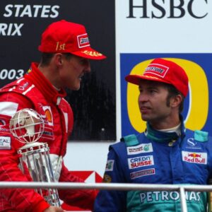 Winner Michael Schumacher (Ferrari, left) congratulates Heinz-Harald Frentzen (both Germany Sauber-Petronas) on his third place in the Motorsport Grand Prix Men's USA Grand Prix 2003