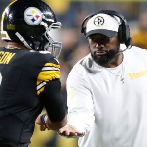 Pittsburgh Steelers head coach Mike Tomlin (right) congratulates quarterback Russell Wilson (3) on his touchdown pass against the New York Jets during the second quarter at Acrisure Stadium.