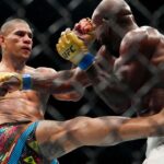 Alex Pereira (red gloves) fights Khalil Rountree Jr. (blue gloves) in a light heavyweight title bout during UFC 307 at Delta Center.