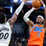 Oklahoma City Thunder guard Shai Gilgeous-Alexander (2) shoots the ball while Indiana Pacers guard Bennedict Mathurin (00) defends in the second half at Gainbridge Fieldhouse.