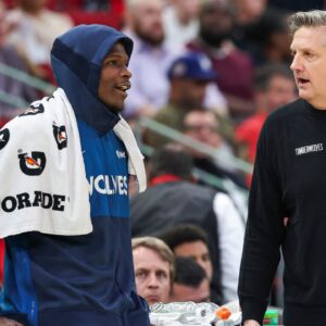 Minnesota Timberwolves head coach Chris Finch talks with guard Anthony Edwards (5) during the fourth quarter against the Houston Rockets at Toyota Center.