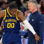 Golden State Warriors forward Jonathan Kuminga (00) reacts after a foul with head coach Steve Kerr against the Sacramento Kings during the second quarter at Chase Center.