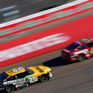 Driver Christopher Bell (20) drives for position against driver Martin Truex Jr. (19) during the Cup Series championship race at Phoenix Raceway.