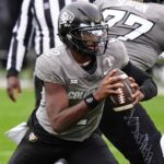 Nov 16, 2024; Boulder, Colorado, USA; Colorado Buffaloes quarterback Shedeur Sanders (2) carries the ball in the second half against the Utah Utes at Folsom Field.