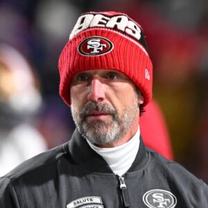 San Francisco 49ers head coach Kyle Shanahan on the field before a game against the Buffalo Bills at Highmark Stadium.