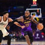 Los Angeles Lakers forward LeBron James (23) moves the ball against Detroit Pistons forward Tobias Harris (12) during the second half at Crypto.com Arena