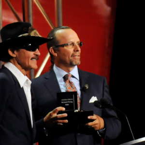 NASCAR Sprint Cup Series former drivers Richard Petty and Kyle Petty during Richard Pettys induction into the 2010 NASCAR hall of fame inaugural induction ceremony in Charlotte, North Carolina.