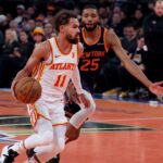 Atlanta Hawks guard Trae Young (11) controls the ball against New York Knicks forward Mikal Bridges (25) during the first quarter at Madison Square Garden.