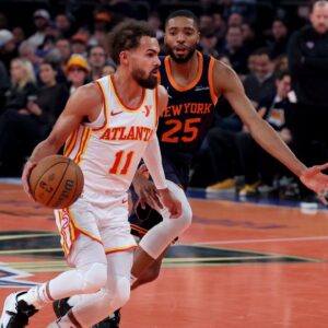 Atlanta Hawks guard Trae Young (11) controls the ball against New York Knicks forward Mikal Bridges (25) during the first quarter at Madison Square Garden.