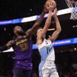 Los Angeles Lakers forward LeBron James (23) blocks the shot of Atlanta Hawks guard Dyson Daniels (5) in overtime at State Farm Arena.