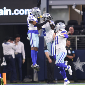 Dec 22, 2024; Arlington, Texas, USA; Dallas Cowboys cornerback Jourdan Lewis (2) celebrates after making an interception in the fourth quarter against the Tampa Bay Buccaneers at AT&T Stadium. Mandatory Credit: Tim Heitman-Imagn Images