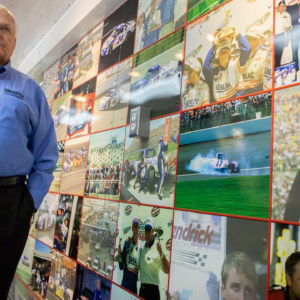 Rick Hendrick pauses to look at the wall of photos that line the trailer from his late son, Ricky Hendrick's race team on display inside the 58,000-square foot Heritage Center in Concord, North Carolina.