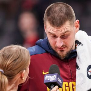Denver Nuggets center Nikola Jokic (15) reacts while being interviewed after the game against the Atlanta Hawks during the second half at State Farm Arena.