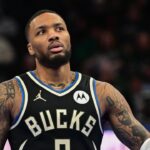 Milwaukee Bucks guard Damian Lillard (0) reacts in the third quarter against the Orlando Magic at Fiserv Forum