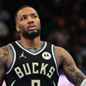 Milwaukee Bucks guard Damian Lillard (0) reacts in the third quarter against the Orlando Magic at Fiserv Forum