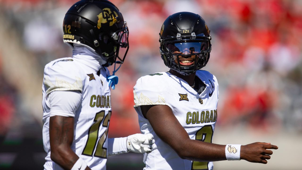 Colorado Buffaloes quarterback Shedeur Sanders (2) with wide receiver Travis Hunter (12) against the Arizona Wildcats at Arizona Stadium.