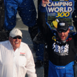 NASCAR Nationwide Series driver Tony Stewart celebrates as car owner Rick Hendrick looks on following the Camping World 300 at Daytona International Speedway.