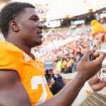 Tennessee defensive lineman James Pearce Jr. (27) autographs items for children after a college football game between Tennessee and UTEP at Neyland Stadium in Knoxville, Tenn., Saturday, Nov. 23, 2024.