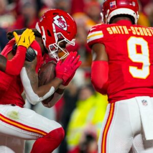 Dec 8, 2024; Kansas City, Missouri, USA; Kansas City Chiefs wide receiver DeAndre Hopkins (8) celebrates with teammate after scoring a touchdown during the first half against the Los Angeles Chargers at GEHA Field at Arrowhead Stadium.