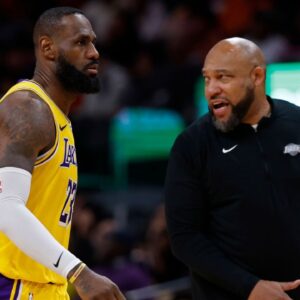 Los Angeles Lakers forward LeBron James (23) talks with Lakers head coach Darvin Ham (R) against the Washington Wizards at Capital One Arena.