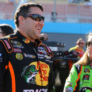 NASCAR Sprint Cup Series driver Tony Stewart (left) talks with teammate Danica Patrick during qualifying for the Subway Fresh Fit 500 at Phoenix International Raceway.