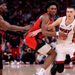 Miami Heat guard Tyler Herro (14) handles the ball against Houston Rockets guard Amen Thompson (1) during the fourth quarter at Toyota Center.