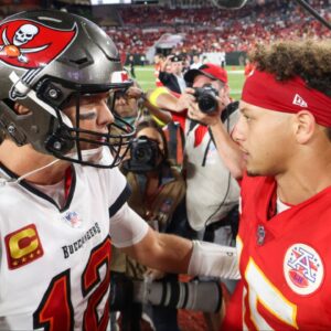Tampa Bay Buccaneers quarterback Tom Brady (12) greets Kansas City Chiefs quarterback Patrick Mahomes (15) after a game at Raymond James Stadium.