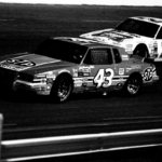 Driver Richard Petty (43) battles Bobby Allison (22) around the Nashville International Raceway oval during early action of the Nashville Coors 420 on May 12, 1984. A record crowd of 22,504 fans watch the NASCAR Winston Cup race.