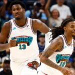 Memphis Grizzlies forward Jaren Jackson Jr. (13) and guard Ja Morant (12) get back on defense during the first half against the Orlando Magic at FedExForum.