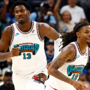 Memphis Grizzlies forward Jaren Jackson Jr. (13) and guard Ja Morant (12) get back on defense during the first half against the Orlando Magic at FedExForum.