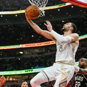 Chicago Bulls guard Zach LaVine (8) shoots against the Milwaukee Bucks during the first half at the United Center.