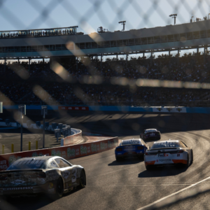 NASCAR Cup Series drivers race into turn three during the NASCAR Cup Series Championship race at Phoenix Raceway.