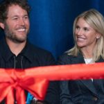 Mathew and Kelly Stafford share a laugh during speeches for the ribbon cutting of the Kelly and Matthew Stafford and Friends Education Center at the S.A.Y Detroit Play Center