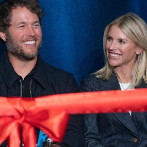 Mathew and Kelly Stafford share a laugh during speeches for the ribbon cutting of the Kelly and Matthew Stafford and Friends Education Center at the S.A.Y Detroit Play Center