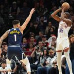 Phoenix Suns forward Kevin Durant (35) shoots over Denver Nuggets forward Michael Porter Jr. (1) during the second half at Footprint Center.
