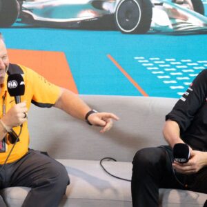 McLaren Chief Executive Officer Zak Brown and Haas team principal Guenther Steiner laugh as they talk with the media during a press conference