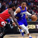 Los Angeles Clippers guard Russell Westbrook (0) moves to the basket against Chicago Bulls guard Patrick Beverley (21) during the second half at Crypto.com Arena.