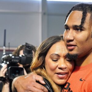 Ohio State quarterback C.J. Stroud hugs his mother, Kim, after his workout on the Buckeyes' pro day. CJ Stroud