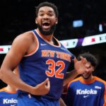 New York Knicks center Karl-Anthony Towns (32) reacts after a three point basket to clinch a win over the Toronto Raptors during the second half at Scotiabank Arena.