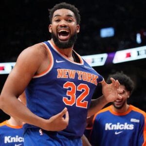 New York Knicks center Karl-Anthony Towns (32) reacts after a three point basket to clinch a win over the Toronto Raptors during the second half at Scotiabank Arena.