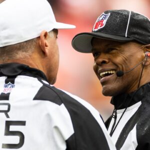 Oct 15, 2023; Cleveland, Ohio, USA; NFL line judge Carl Johnson (101) talks with referee John Hussey (35) during the second quarter between the Cleveland Browns and the San Francisco 49ers at Cleveland Browns Stadium.