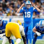 Detroit Lions quarterback Jared Goff (16) talks to teammates before a snap against Green Bay Packers during the first half at Ford Field in Detroit on Thursday, Dec. 5, 2024.