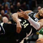 Milwaukee Bucks forward Giannis Antetokounmpo (34) tries to save the ball from going out of bounds during the first half against the Cleveland Cavaliers at Rocket Mortgage FieldHouse.
